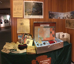 The contents of the Fort Clatsop Explorers trunk are spread across chairs  and tables.